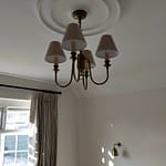 ceiling rose with brass 4 piece chandelier and wall light similar in background
