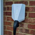 ease one ev charger white installed on brick wall
